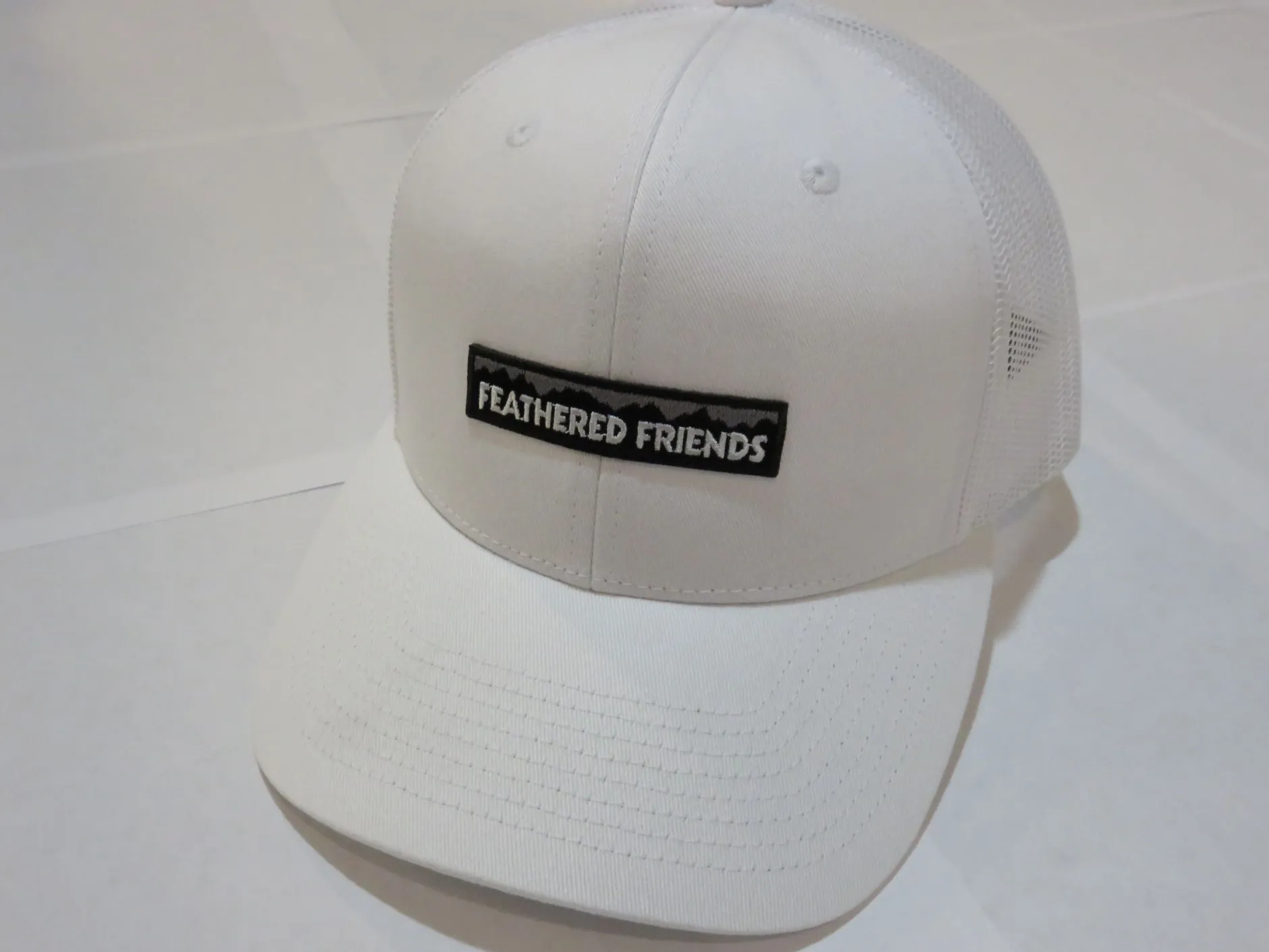 Feathered Friends Pro Style Trucker Mountain Logo Patch Hat