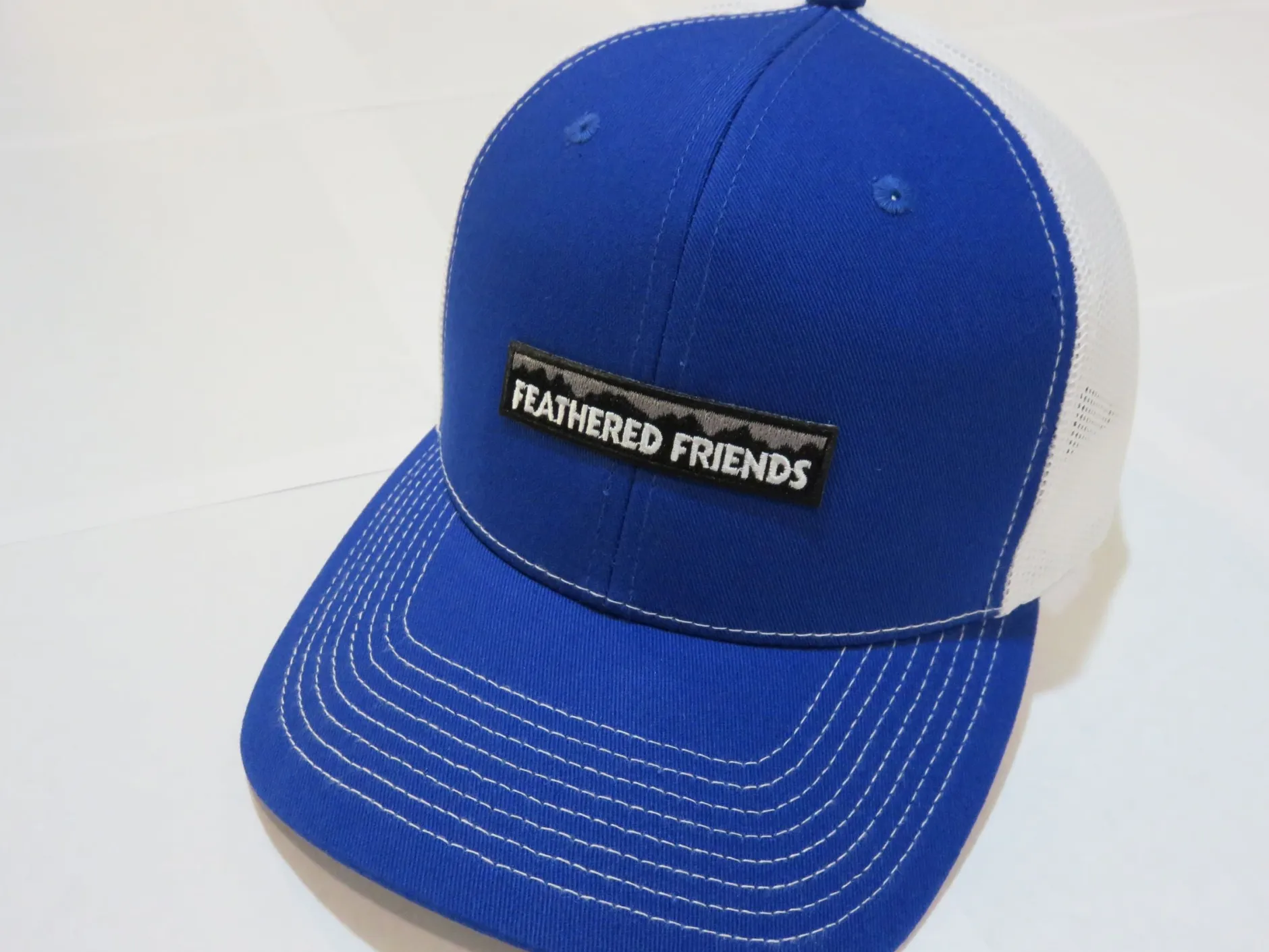 Feathered Friends Pro Style Trucker Mountain Logo Patch Hat