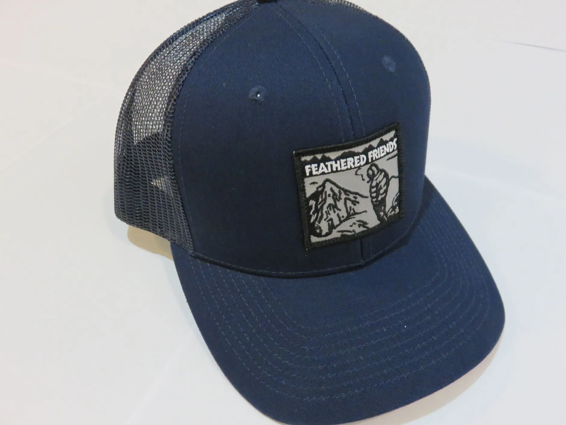 Feathered Friends Smoking Man Pro Style Trucker Hat