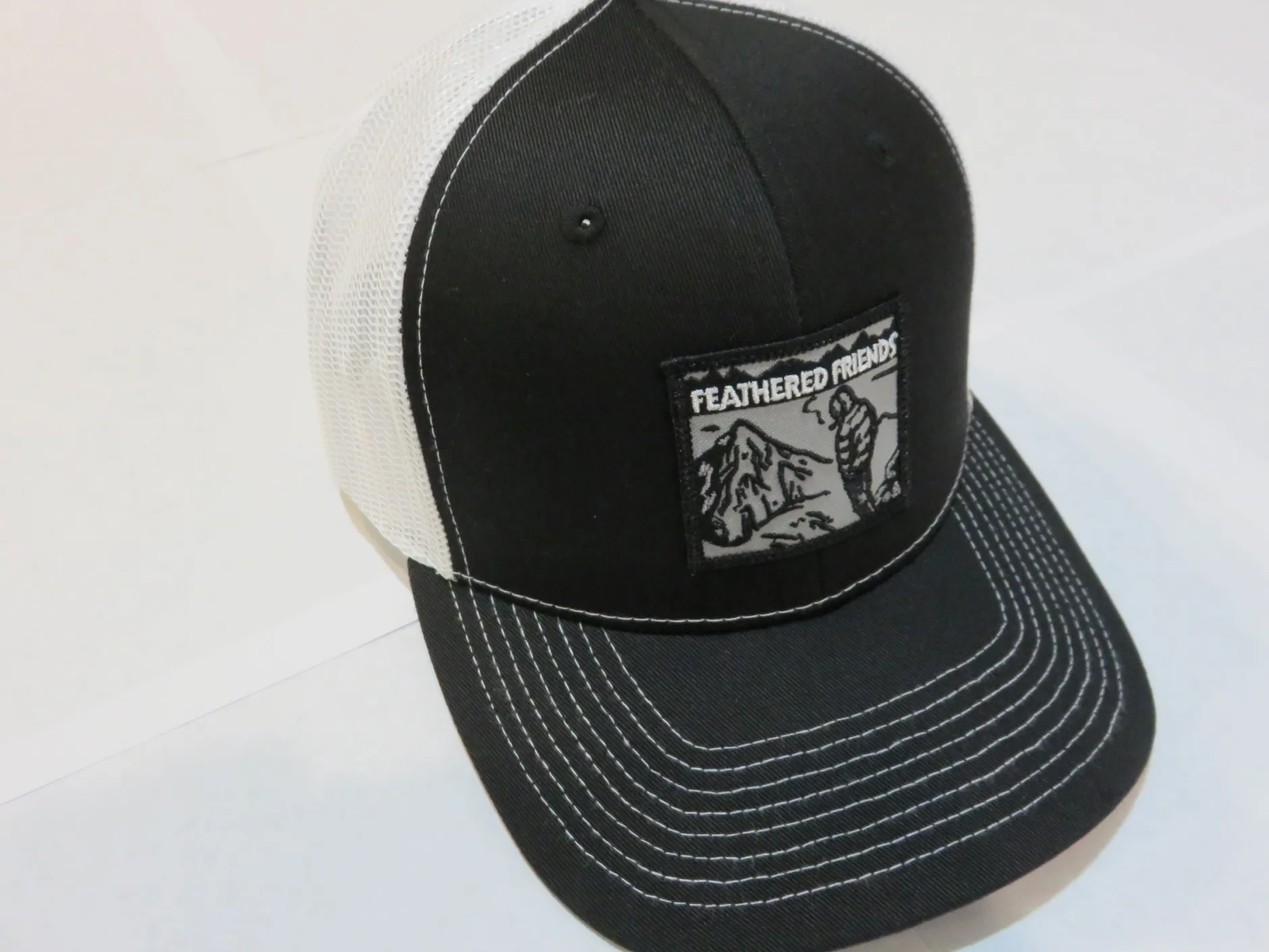 Feathered Friends Smoking Man Pro Style Trucker Hat