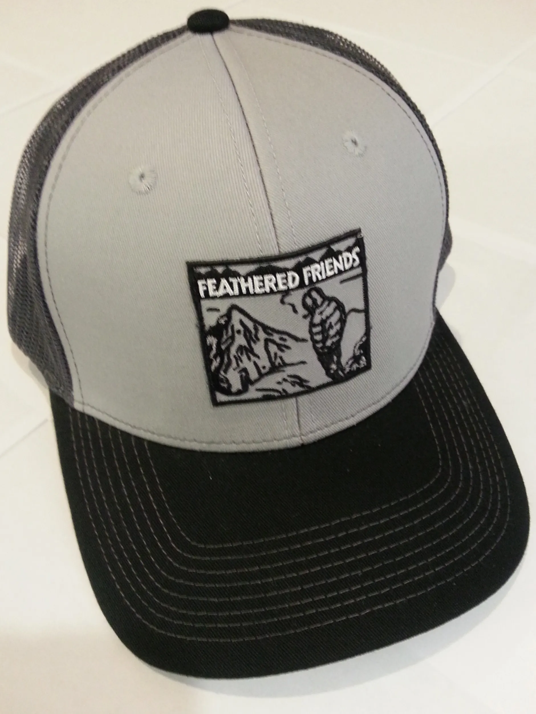 Feathered Friends Smoking Man Pro Style Trucker Hat