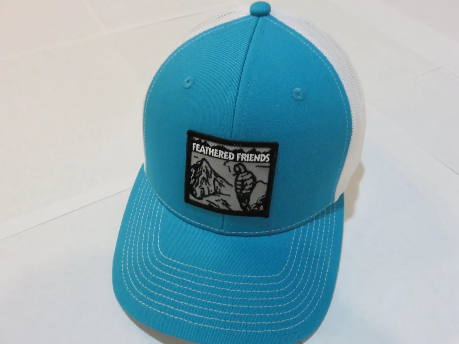 Feathered Friends Smoking Man Pro Style Trucker Hat