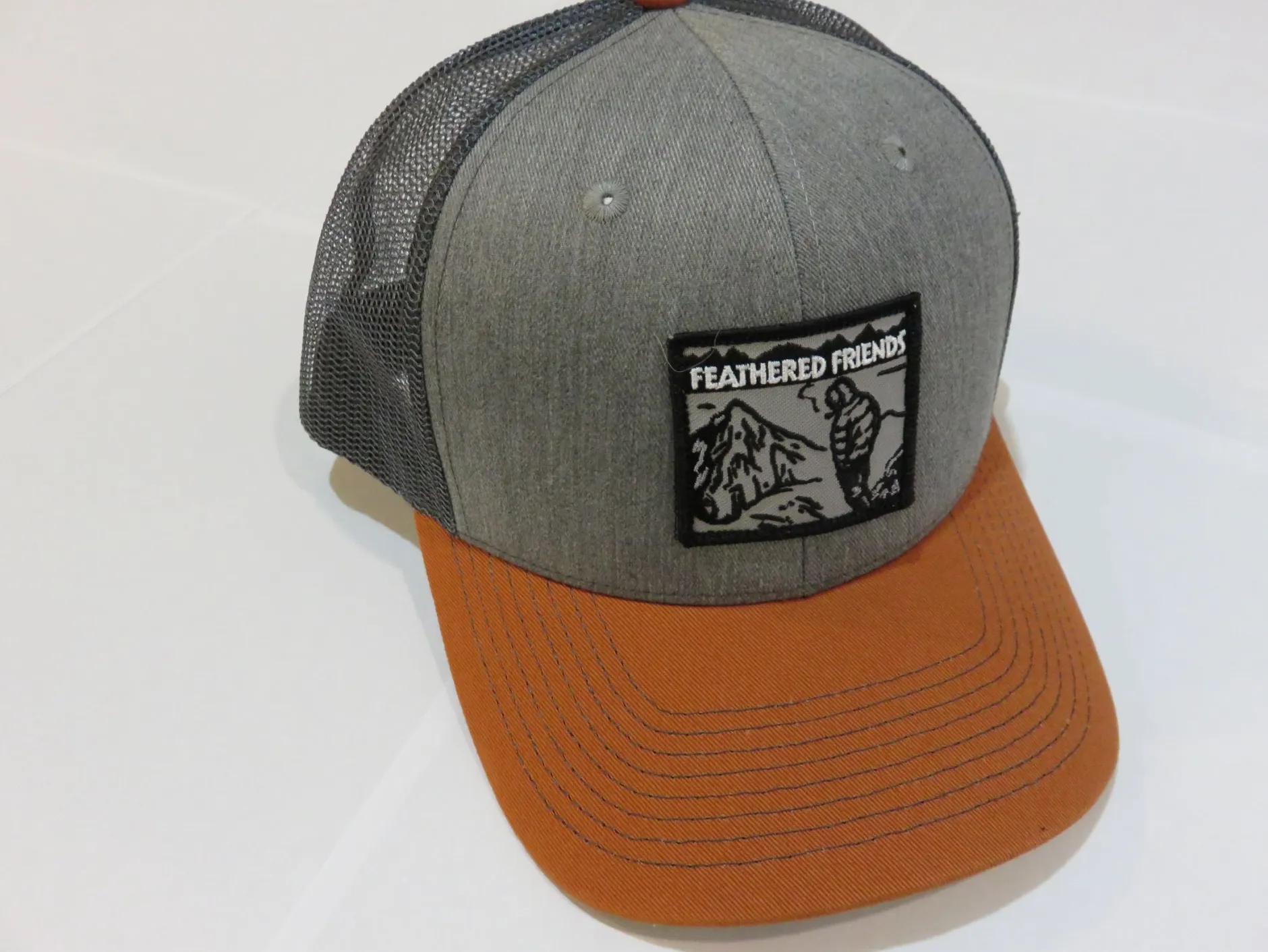 Feathered Friends Smoking Man Pro Style Trucker Hat