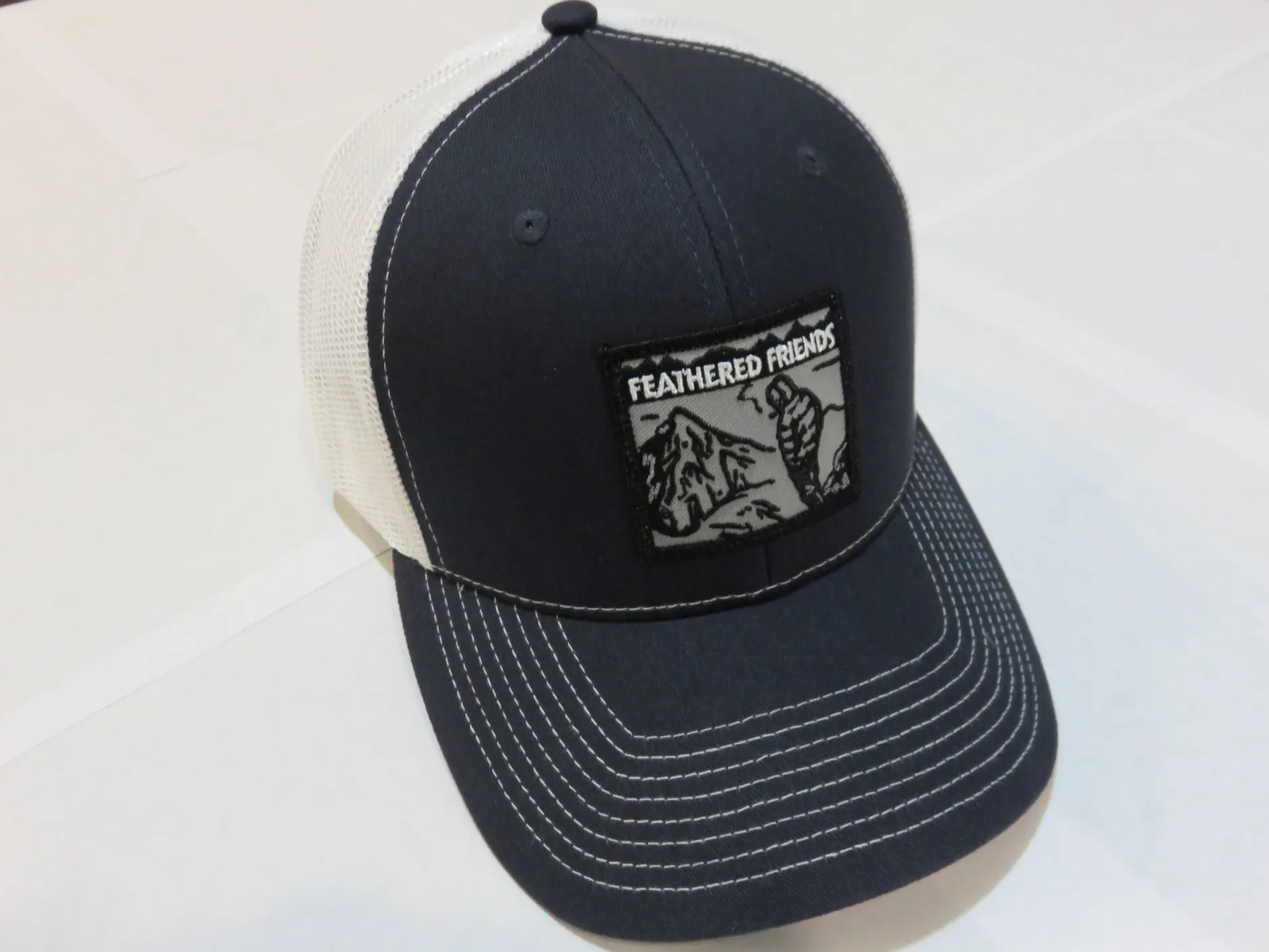 Feathered Friends Smoking Man Pro Style Trucker Hat