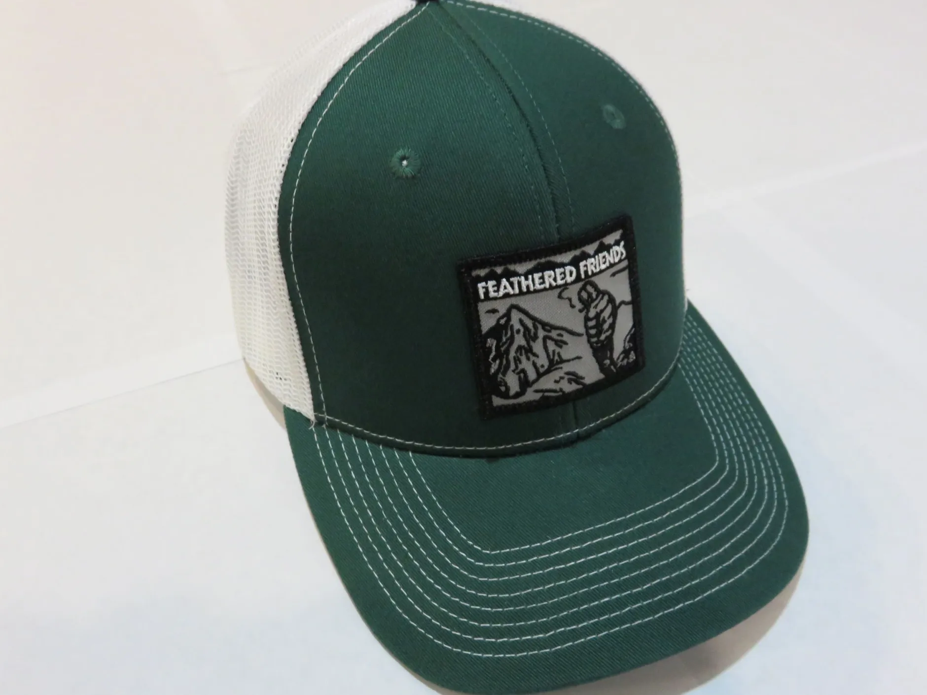 Feathered Friends Smoking Man Pro Style Trucker Hat