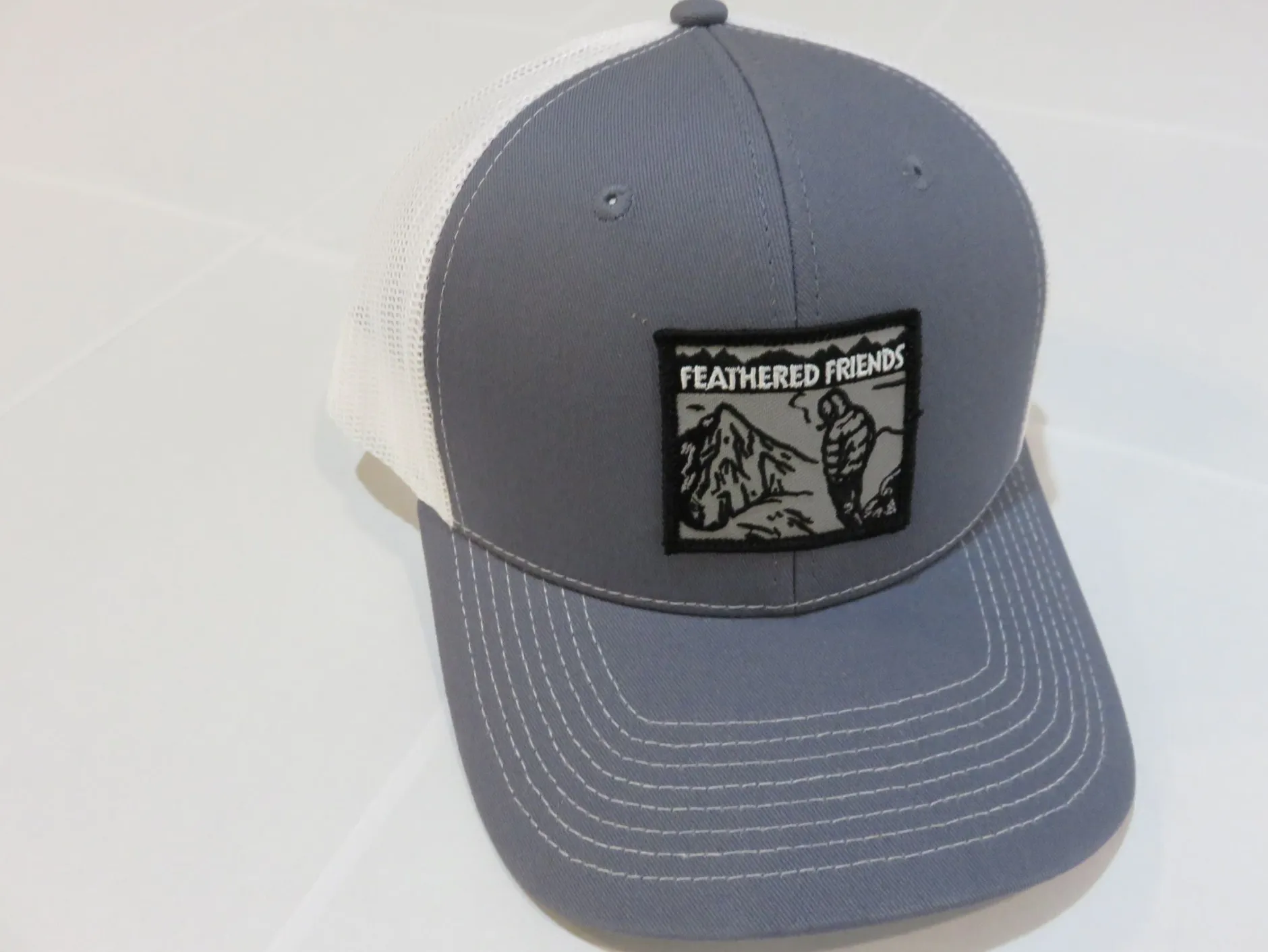 Feathered Friends Smoking Man Pro Style Trucker Hat